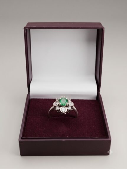 Vibrant Oval Emerald & Brilliant Diamond Cluster Ring